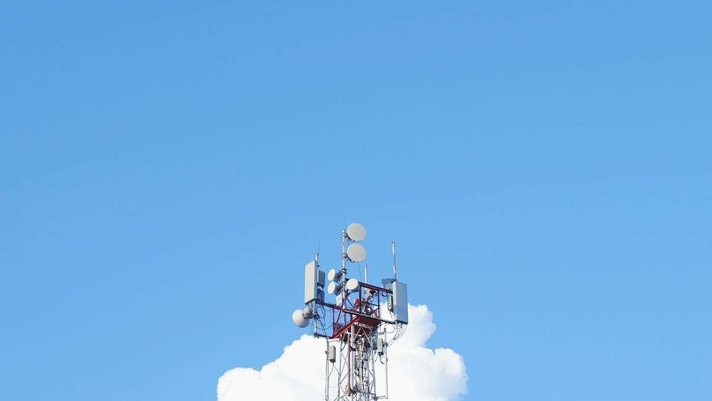 Cellular antenna mast against a blue sky
